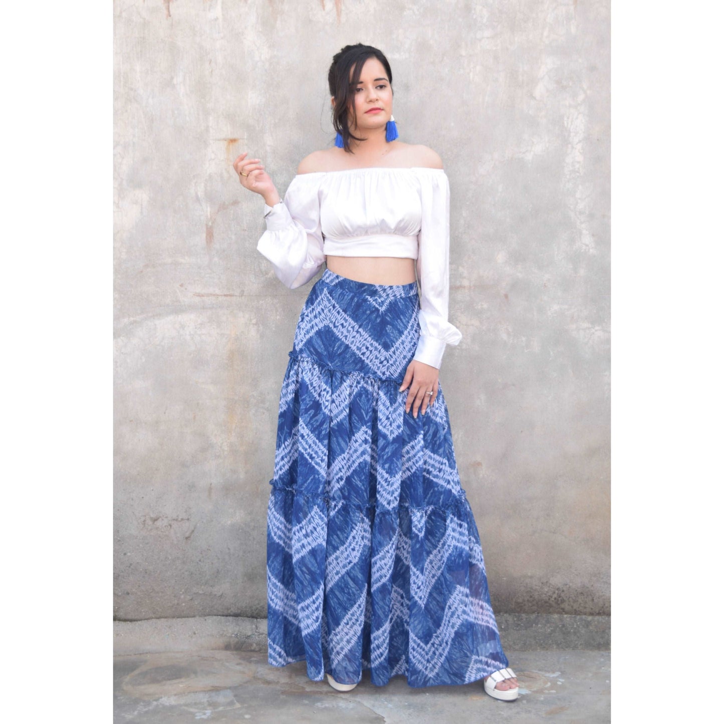 Discover the vibrant charm of our Blue Tie and Dye Printed Tiered Flared Skirt, now on sale at APEKSH. This eye-catching skirt features a unique tie and dye pattern,dye printed tiered flared skirt