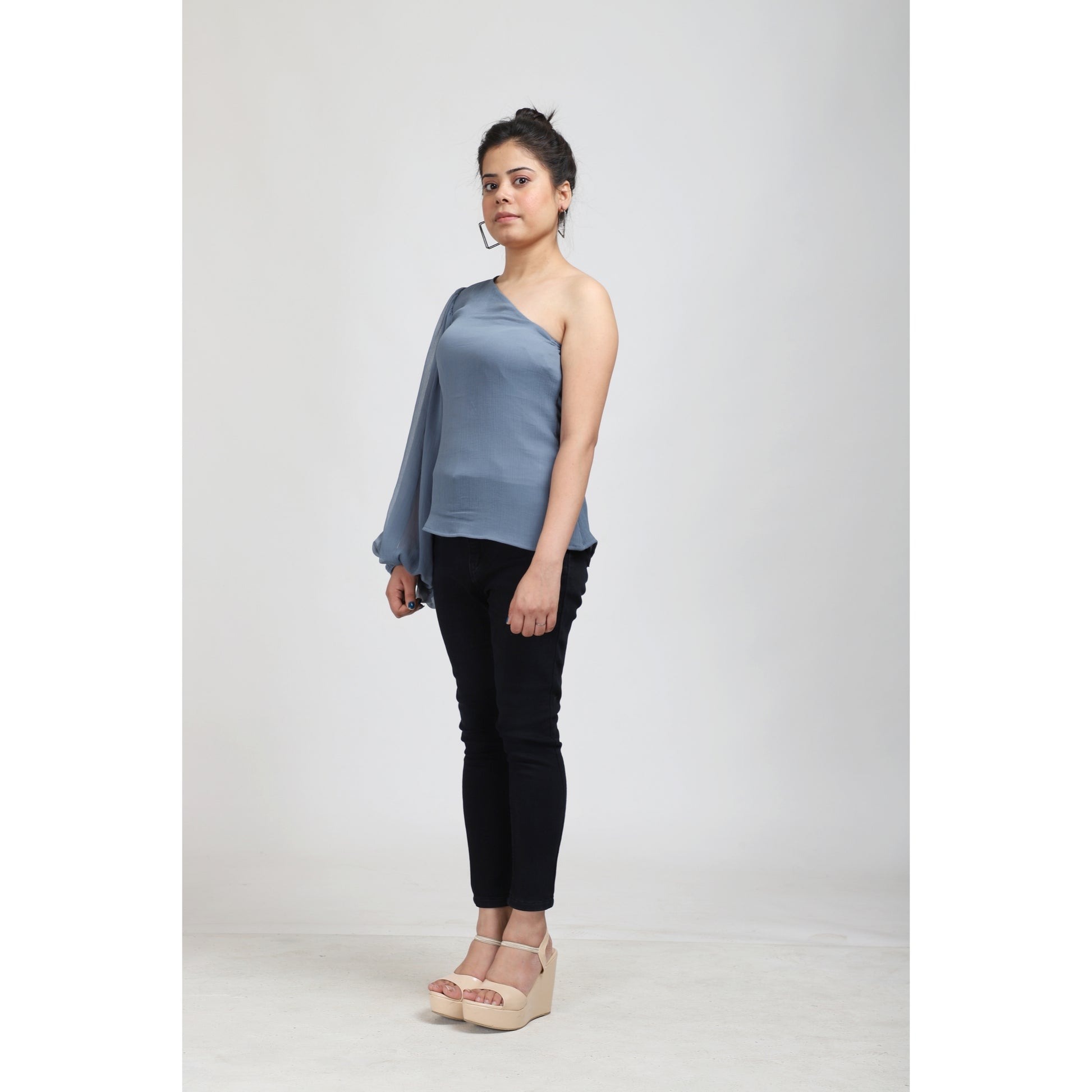 Elevate your style with the Pastel Blue One Shoulder Balloon Sleeve Top, now available at a special sale price at APEKSH. This chic top features a trendy one-shouldeshoulder balloon sleeve top