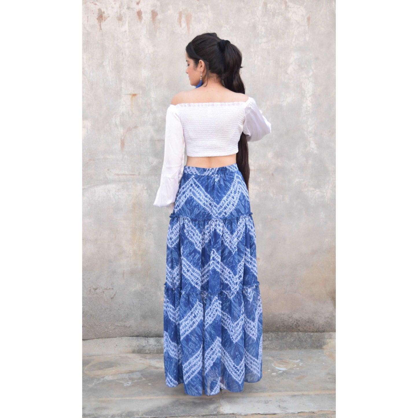 Discover the vibrant charm of our Blue Tie and Dye Printed Tiered Flared Skirt, now on sale at APEKSH. This eye-catching skirt features a unique tie and dye pattern,dye printed tiered flared skirt