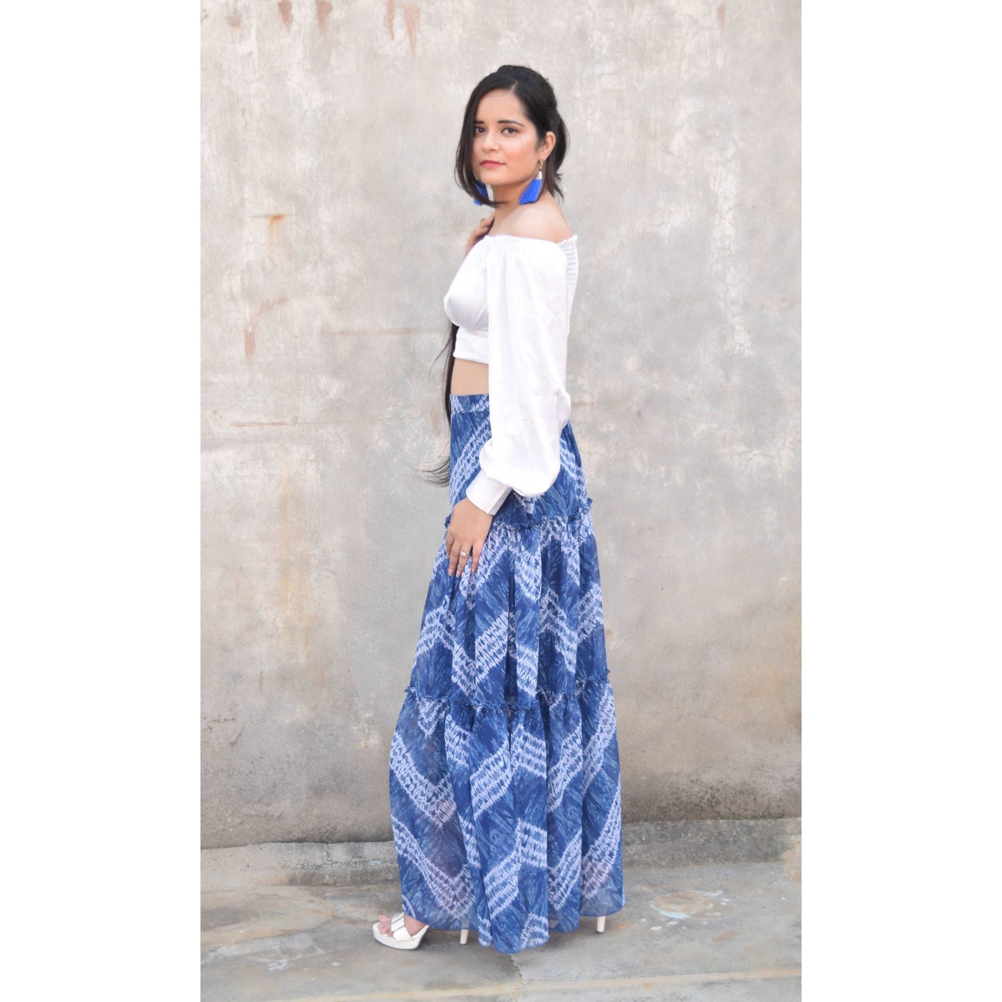 Discover the vibrant charm of our Blue Tie and Dye Printed Tiered Flared Skirt, now on sale at APEKSH. This eye-catching skirt features a unique tie and dye pattern,dye printed tiered flared skirt