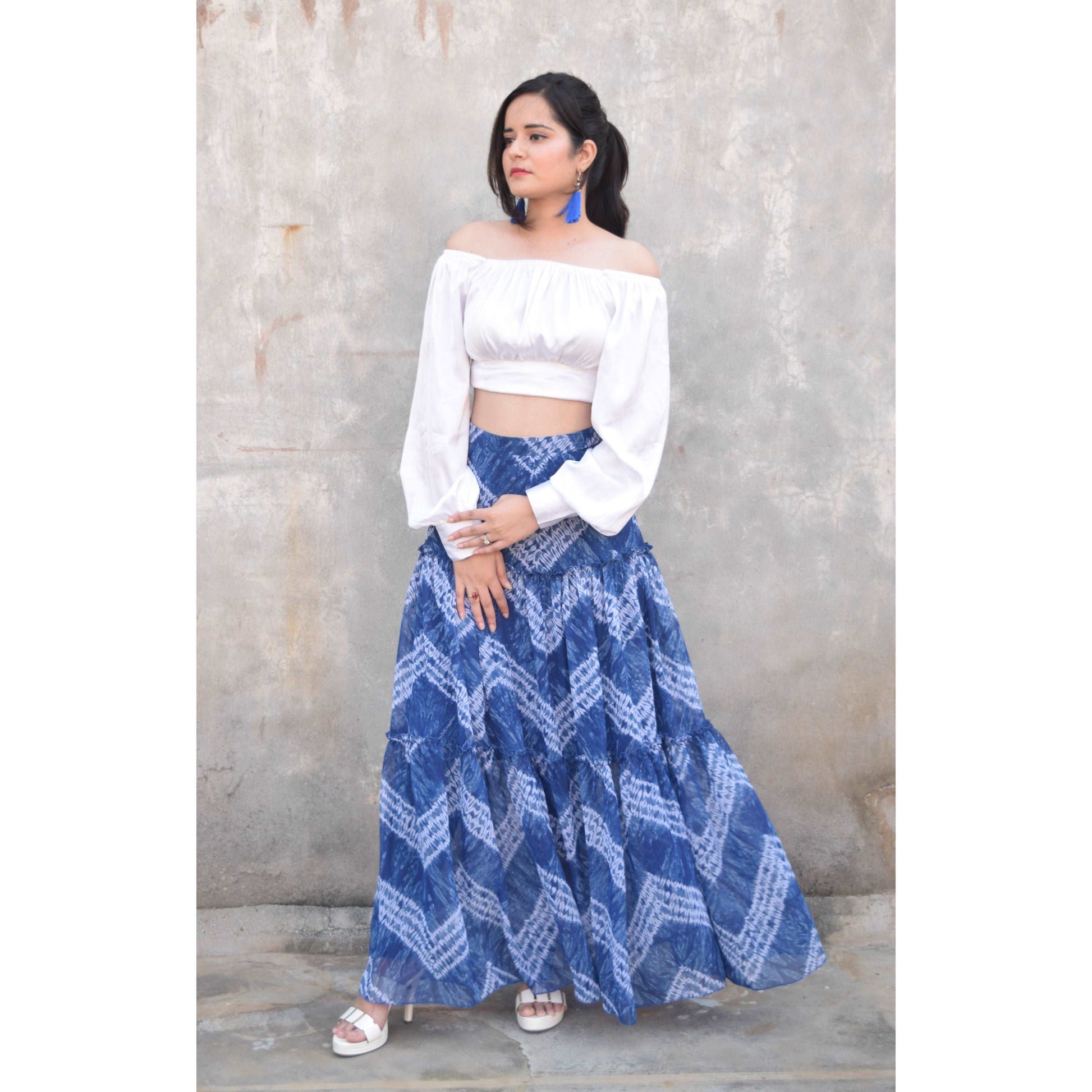 Discover the vibrant charm of our Blue Tie and Dye Printed Tiered Flared Skirt, now on sale at APEKSH. This eye-catching skirt features a unique tie and dye pattern,dye printed tiered flared skirt