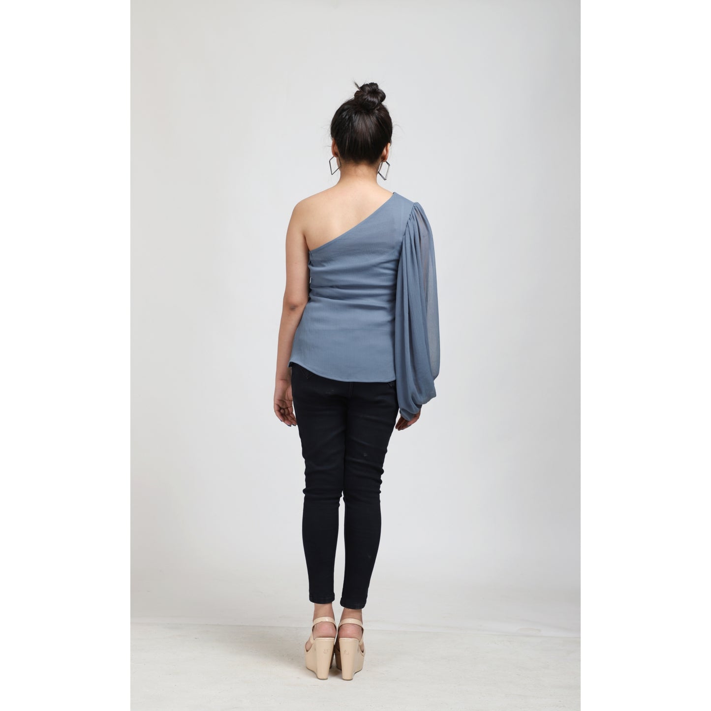 Elevate your style with the Pastel Blue One Shoulder Balloon Sleeve Top, now available at a special sale price at APEKSH. This chic top features a trendy one-shouldeshoulder balloon sleeve top